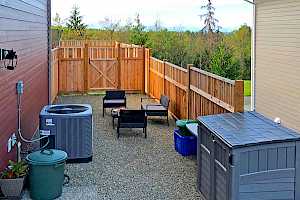 Heat pump installation as part of a CORE Landscape side yard patio area.